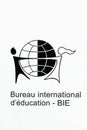 International Bureau of Education logo on a wall