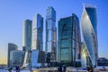 International business center `Moscow City` on a winter sunny day and people against its background. Moscow, Russia.
