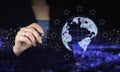 International business concept. Hand holding digital graphic pen and drawing digital hologram world, earth, map, globe sign on Royalty Free Stock Photo