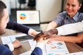 International business team showing unity with their hands stacked together in pile. Black african-american hand on top Royalty Free Stock Photo