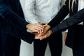 International business team showing unity with their hands together in office Royalty Free Stock Photo