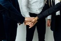 International business team showing unity with their hands together in office Royalty Free Stock Photo