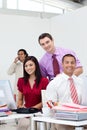 International business team smiling at the camera Royalty Free Stock Photo