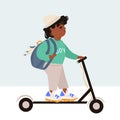 International Children`s Day. Modern children. Afro american boy in trendy clothes with a backpack rides an electric scooter.