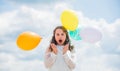 International childrens day. Happy child with colorful air balloons over blue sky background. express positive emotions Royalty Free Stock Photo