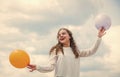 international childrens day. Happy child with colorful air balloons over blue sky background. express positive emotions Royalty Free Stock Photo