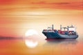 International Container Cargo ship in the ocean as sunset sky, Freight Transportation, Shipping Royalty Free Stock Photo