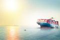 International Container Cargo ship in the ocean at sunset sky, Freight Transportation, Nautical Vessel Royalty Free Stock Photo