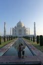 International couple is kissing in front of the Taj Mahal - Romantic tourism in India