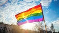 International Day Against Homophobia, bright rainbow background, lgbt flag flying in the sky, lgbt parade Royalty Free Stock Photo