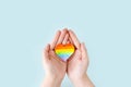 International Day Against Homophobia, Transphobia and Biphobia. May 17. Stop Homophobia. Heart with rainbow LGBT flag in the hands Royalty Free Stock Photo