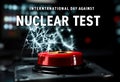 International day against nuclear tests: red button with nuclear symbol Royalty Free Stock Photo