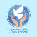 International day of peace - hands are letting the dove of peace to fly on blue circle world on soft blue background modern flat Royalty Free Stock Photo