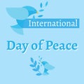 International day of peace text with two doves holding olive branches on blue background Royalty Free Stock Photo