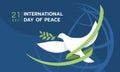 International day of peace - The white peace dove flying with green ribbon roll around on blue line globle texture background