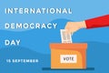 International Democracy Day banner with hand putting in the paper vote to box