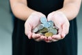 International donation concept - close up of children hands holding euro and international money coins Royalty Free Stock Photo