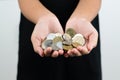 International donation concept - close up of children hands holding euro and international money coins Royalty Free Stock Photo