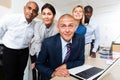 International group of happy businessmen in white room