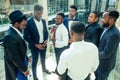 International group of nine african american and indian people having a rest after brain storm in big office Royalty Free Stock Photo