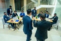 International group of nine african american and indian people having a rest after brain storm in big office Royalty Free Stock Photo