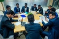 International group of nine african american and indian people having a rest after brain storm in big office Royalty Free Stock Photo