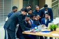 International group of nine african american and indian people having a rest after brain storm in big office Royalty Free Stock Photo