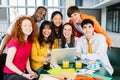 International group of young college students smiling at camera sitting together Royalty Free Stock Photo