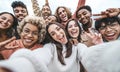 International group of young people laughing at camera outside Royalty Free Stock Photo