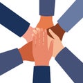 International hands of people folded in center together, unity group symbol, teamwork, work partnership. Top view of