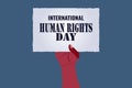 International Human Rights Day concept, Illustrator vector hand hold paper on blue background Royalty Free Stock Photo