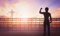 International human rights day concept: Silhouette of man raised hands Religious freedom Royalty Free Stock Photo