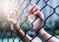 International Human Rights Day Concept, Women hand on chain-link fence. Depressed, trouble and solution Royalty Free Stock Photo