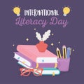 International literacy day, ink and feather on books glasses and pencils