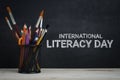 International Literacy Day. School Stationary on Blackboard