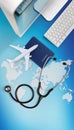 International medical travel insurance concept,stethoscope, passport, computer and airplane on sky background with global map Royalty Free Stock Photo