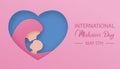 International Midwives Day. Female doctor holds a newborn baby on heart shaped background Royalty Free Stock Photo