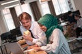 International multicultural business team.A young business man and woman sit in a modern relaxation space and talk about