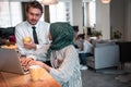 International multicultural business team.A young business man and woman sit in a modern relaxation space and talk about