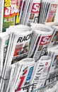International newspaper stand displaying headlines of tabloids Royalty Free Stock Photo
