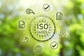 International Organization for Standardization ISO 14001. Different virtual icons on blurred green background