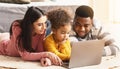 International parents teach child to use computer Royalty Free Stock Photo