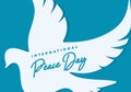 International peace day background on September 21 with big pigeon on blue background Royalty Free Stock Photo