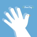 International peace day with hand making the shape of a dove on a blue sky background Royalty Free Stock Photo