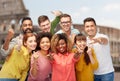 International people showing thumbs up at coliseum Royalty Free Stock Photo