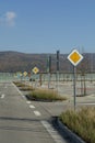 International road signs \'Main road\' or \'Priority road\' in a row. Many yellow squares signs