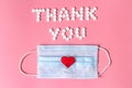 International`s nurses day, week concept, Text Thank you by tablets and red heart on pink background. Royalty Free Stock Photo