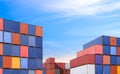International shipping logistics background. Pile of many cargo containers stacked in terminal shipping yard area Royalty Free Stock Photo