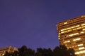 The International Space Station Flying Over A Starry Night Sky Over City