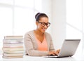 International student girl with laptop at school